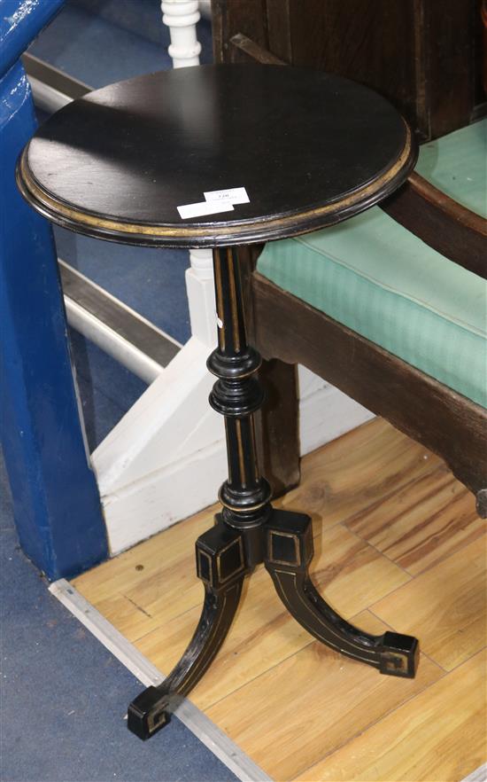 A Victorian parcel gilt ebonised tripod table, Diam. 43cm